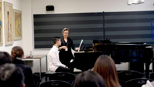 Thumbnail Image for Prof. Wong speaking with piano masterclass performer.