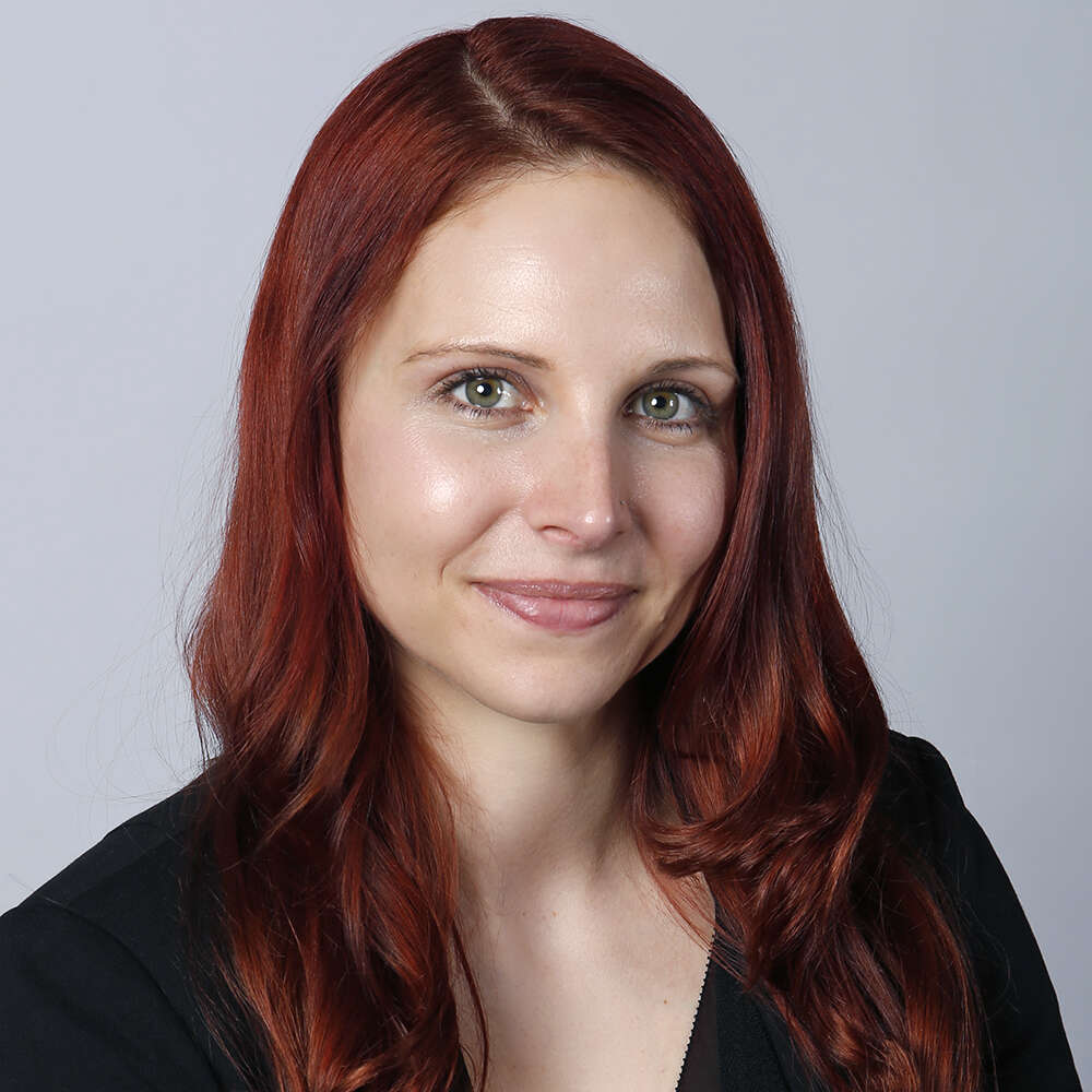 Professional headshot of Brittney Cathcart against a white backdrop.