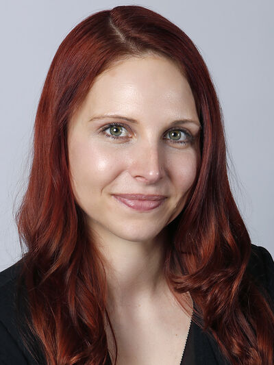 Professional headshot of Brittney Cathcart against a white backdrop.