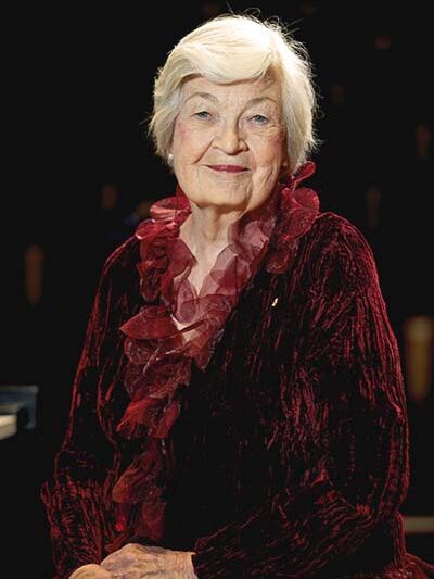 Portrait of older person in a red velvet shirt