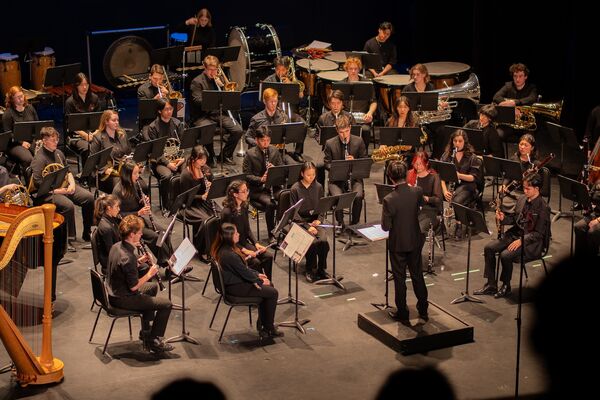 Wind symphony with a Student Conductor performing a piece
