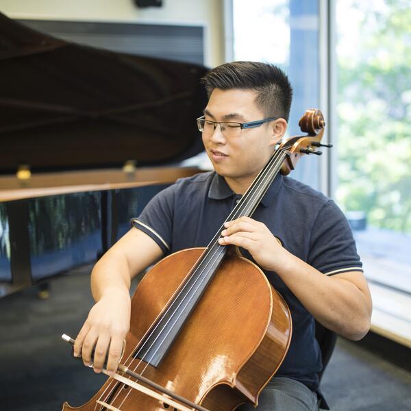 U of T cellist practices in a classroom.
